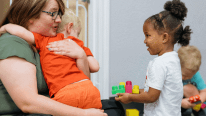Woman hugging child.